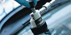Repairing a windshield at Low Price Auto Glass windshield repair