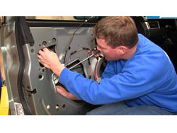 Technician Working on Power Window Repair